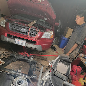 K&P technicians performing automotive repair on a vehicle engine in the Holbrook, Arizona shop